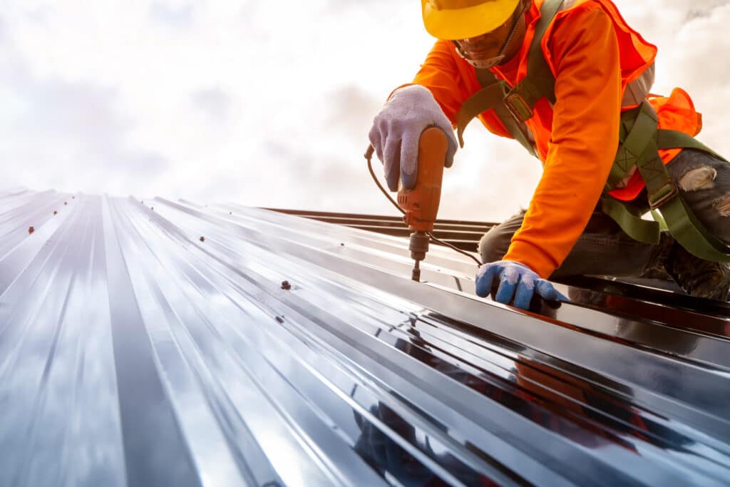 Construction worker install new roof